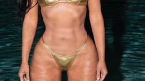 Kim Kardashian in a gold bikini